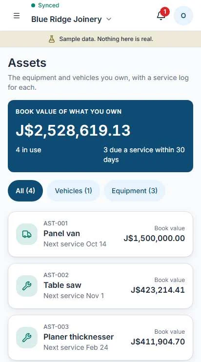 The assets register on a phone listing a vehicle and equipment with their next service dates.
